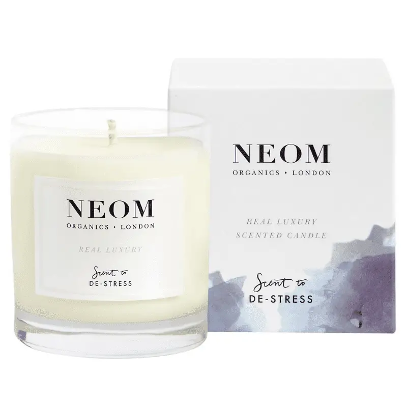 A candle and box by Neom Organics