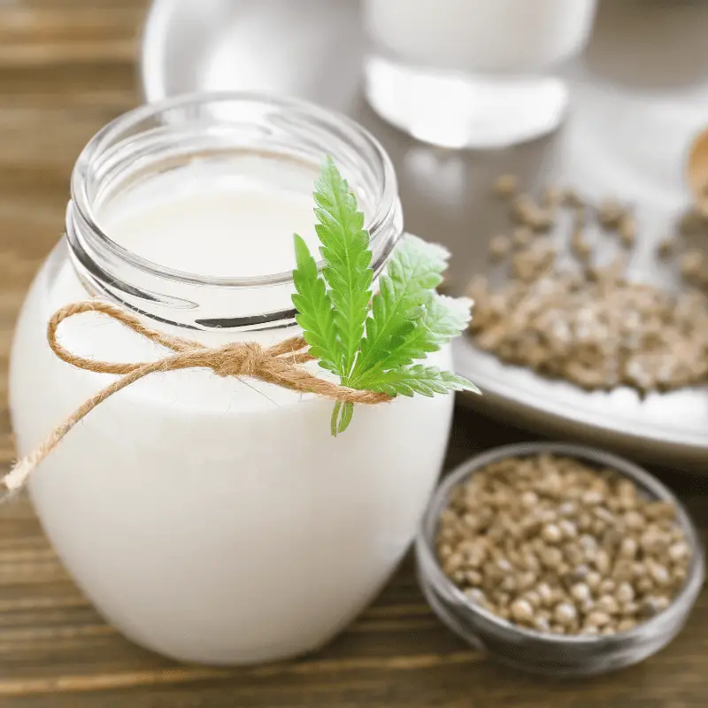 Jar with hemp milk on table