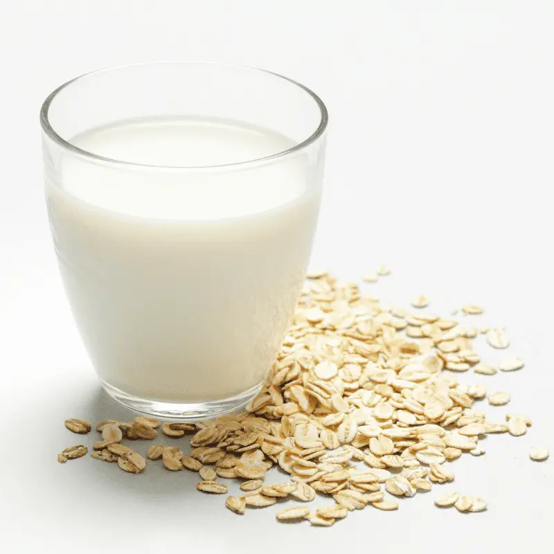  Oat milk and rolled oats. Organic vegan non-dairy plant-based milk in a glass.