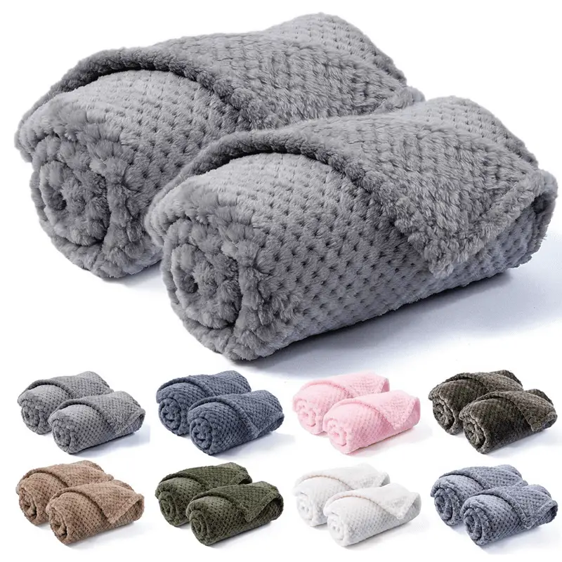 Luxury blankets in eight colours on a white background