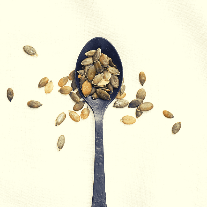 Pumpkin seeds on a teaspoon