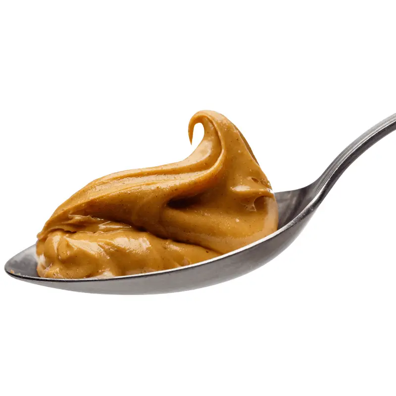 A spoon with peanut butter on