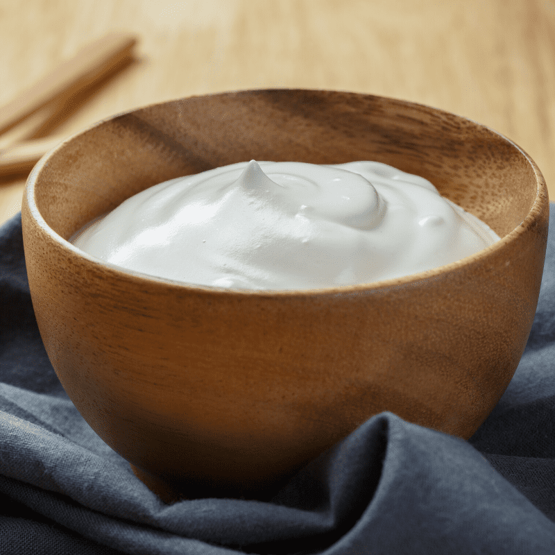 Plain yoghurt in a wooden bowl