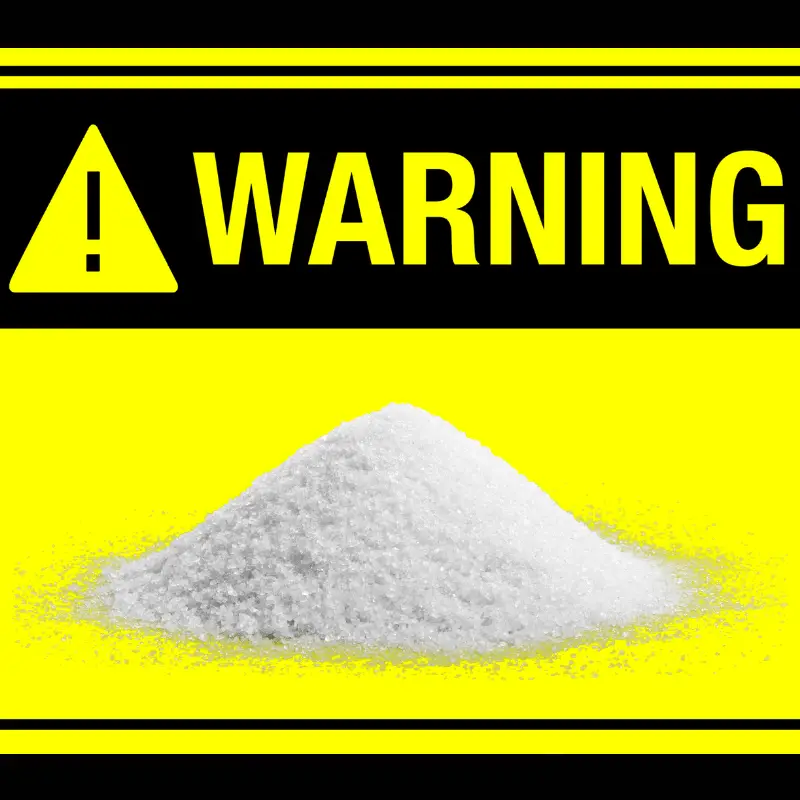 Images of sugar with a warning sign to indicate their harmful effects on dogs.